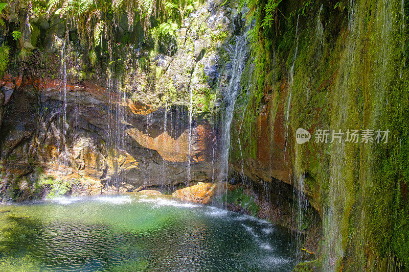 25 Fontes waterfalls in the mountains near Rabaçal and Levada do Risco walkway on Madeira island during a beautiful summer day